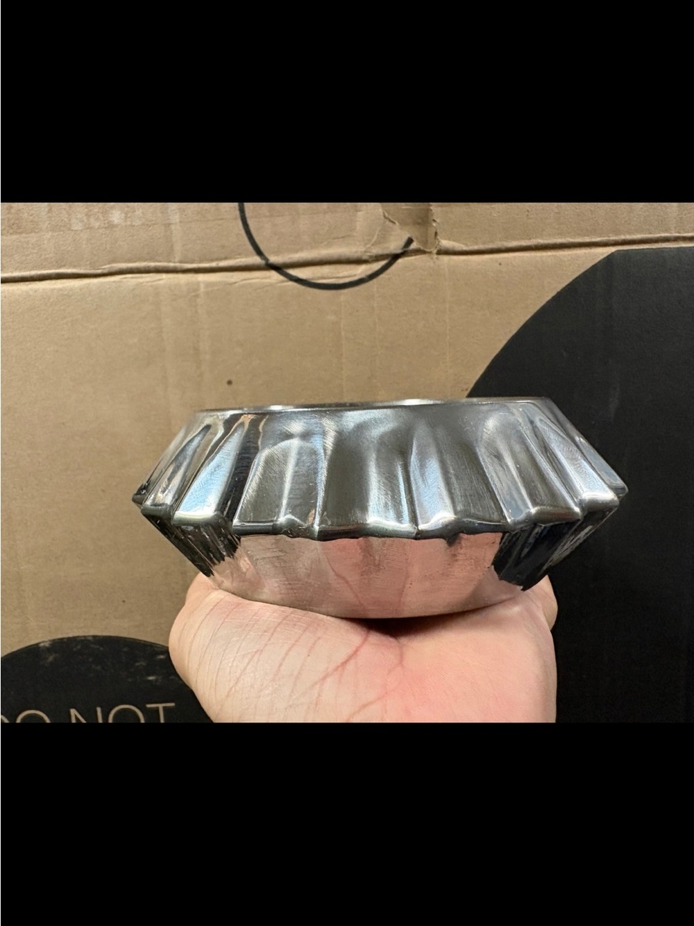 Silver metal wine coaster from Threshold